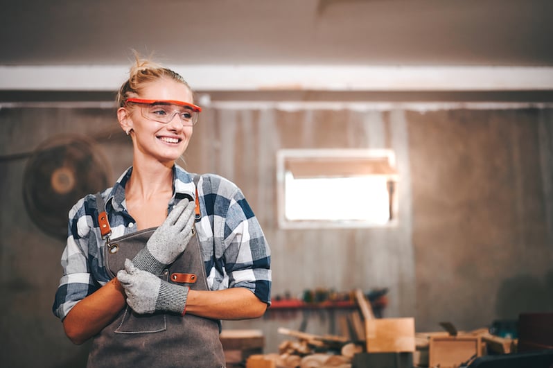 worker smiling after successfully completing preventive maintenance tasks