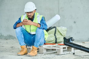worker taking a break during an eight hour shift due to machine idle time