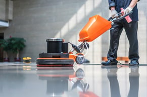 man cleaning with a floor polishing as part of his routine maintenance tasksmachine as 